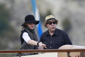 Madonna, sunglasses, black hat, braids, black tshirt, white long sleeved shirt, black wristband